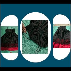 Black dress with red on the bottom with Fringe